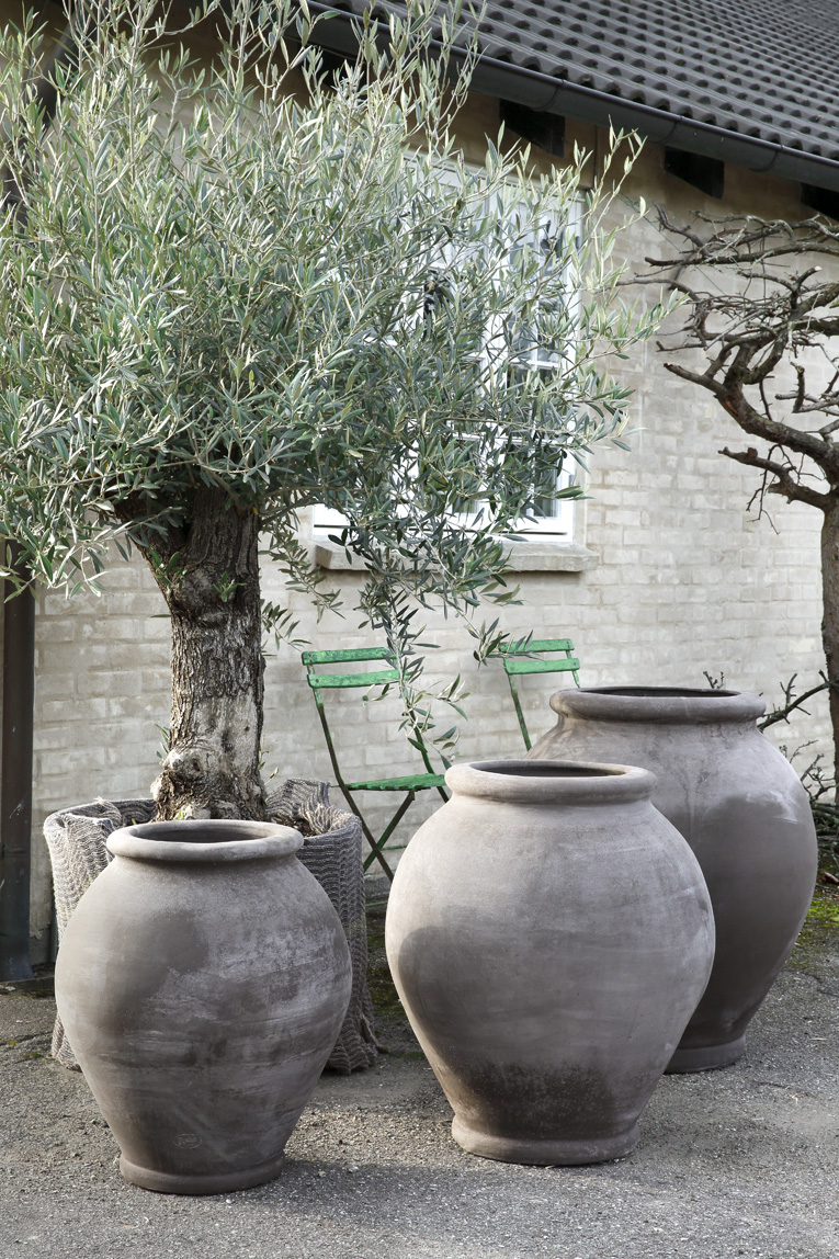 Three amphora-shaped raw grey outdoor pots.