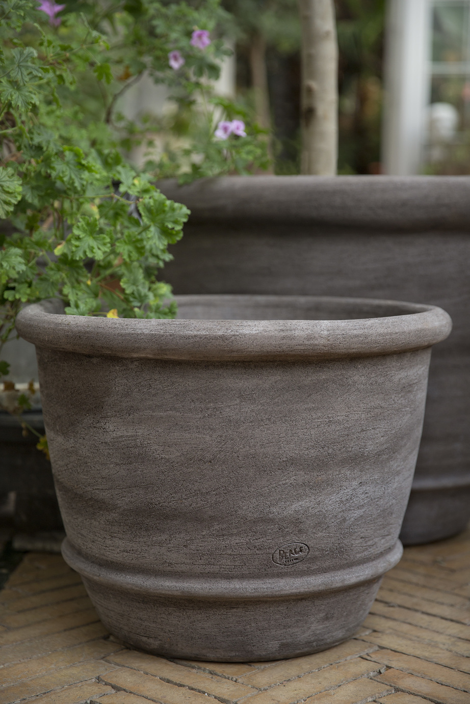 Large grey bell shaped outdoor pot