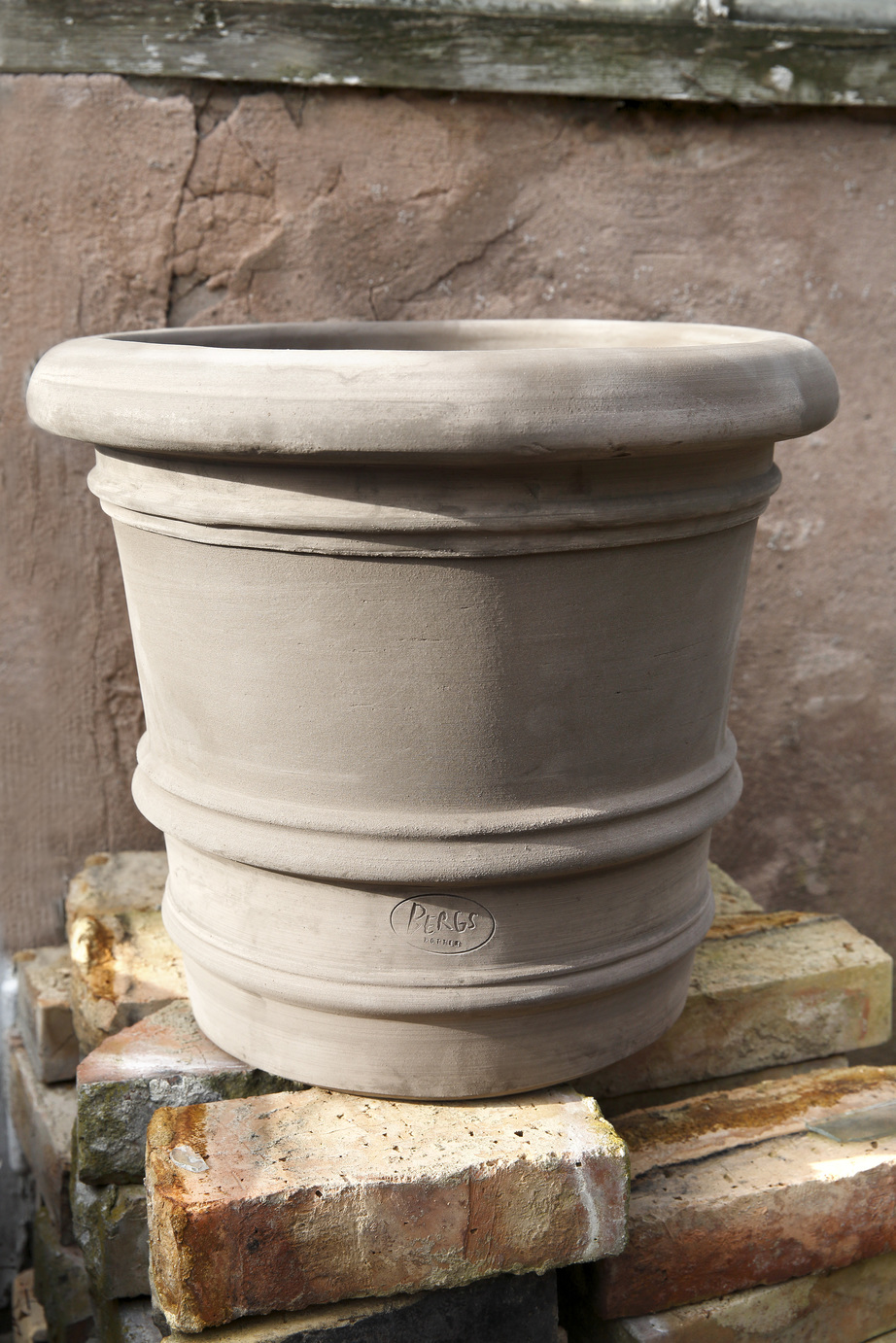 Large empty grey outdoor pot.