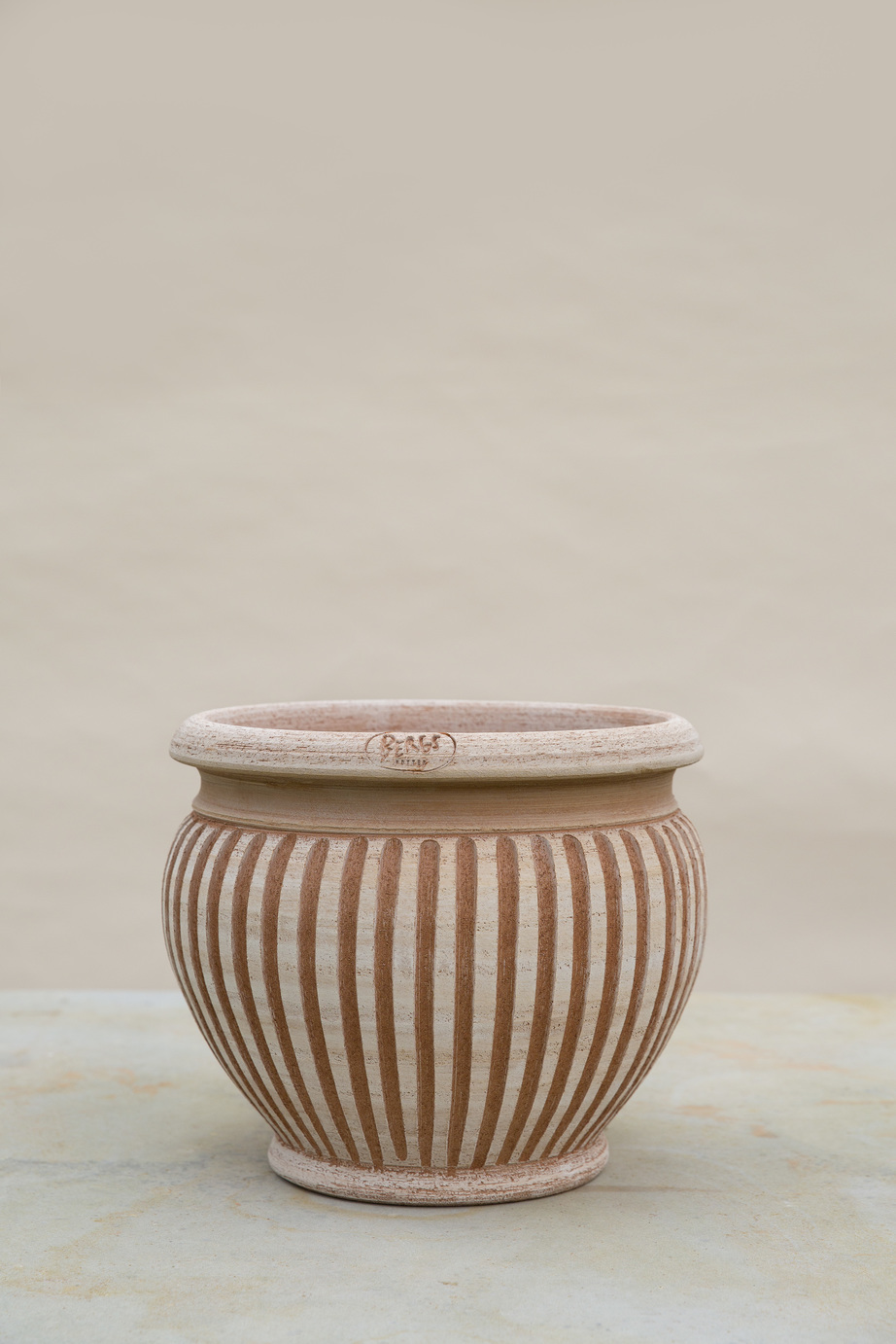 Raw rose outdoor pot with vertical lines.