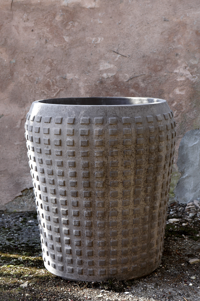 Large grey outdoor pot with square pattern.