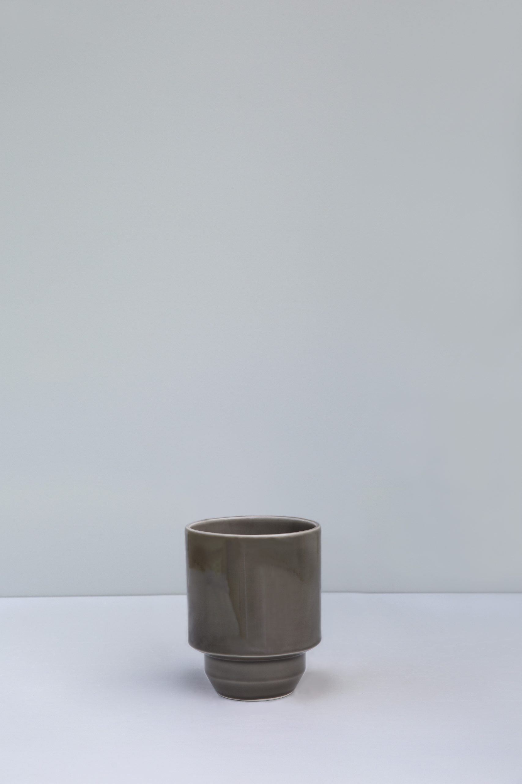 Empty glazed pearl grey pot.