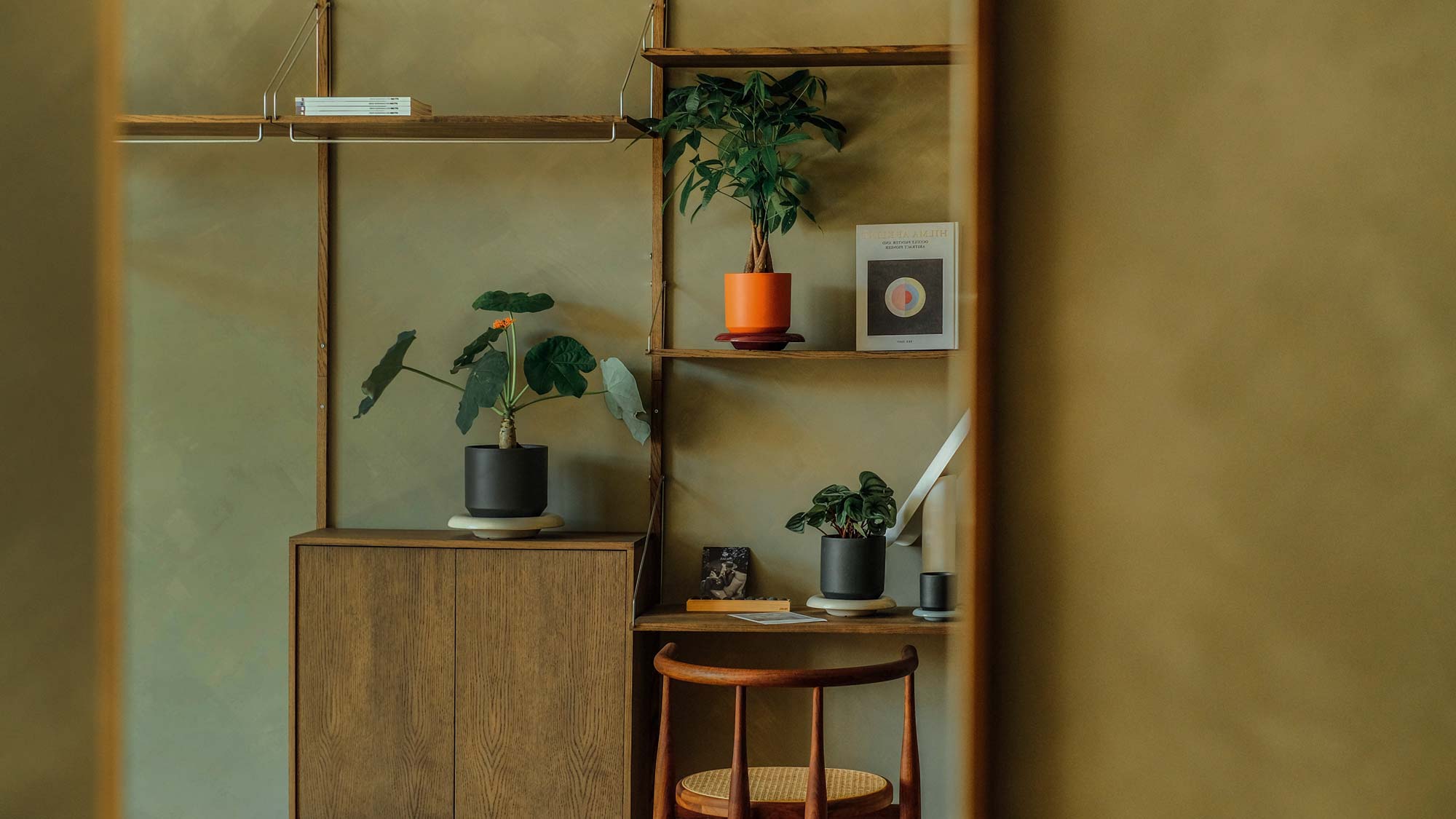 Modern study corner with Bergs Potter Lily pots in orange and charcoal glaze